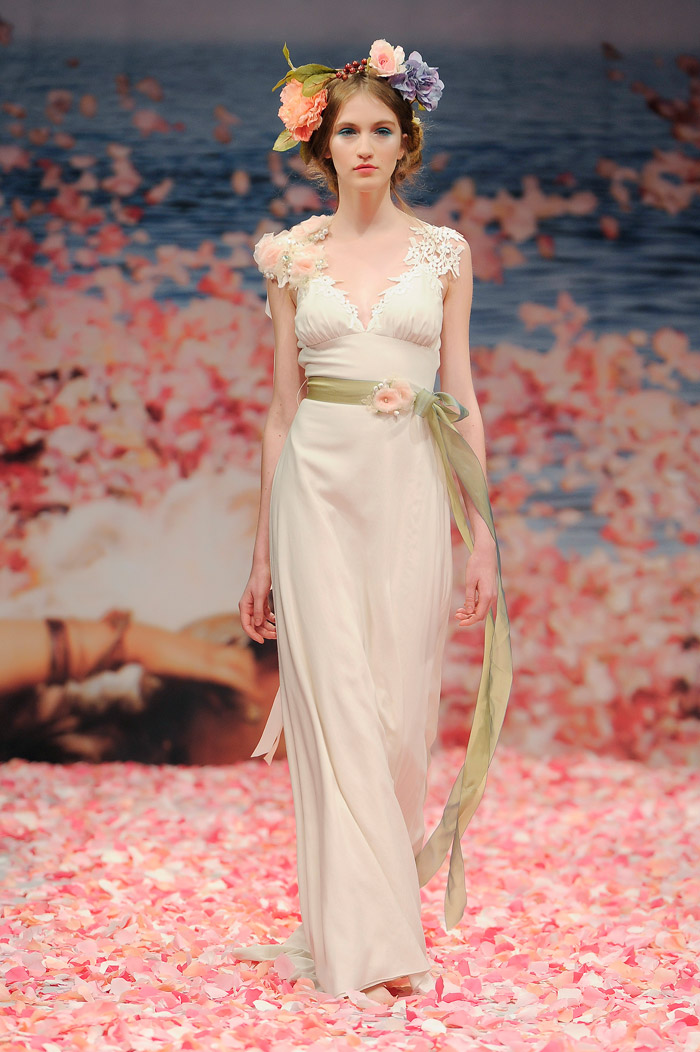 Claire Pettibone 2013 Fall Collection – Maiden. Ivory linen with guipure leaves and jeweled blossom shoulder with green ribbon waist sash. www.theweddingnotebook.com
